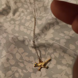 Blue glass eyed golden roadrunner pendant necklace